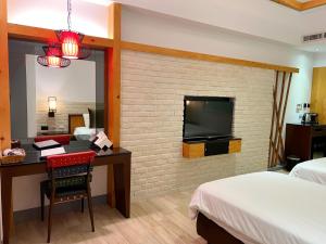Televisyen dan/atau pusat hiburan di Shange Beach Club Homeatay