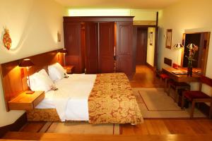 Cama ou camas em um quarto em Pousada Mosteiro de Guimaraes