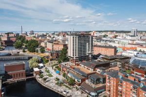 an aerial view of a city with a river and buildings at Original Sokos Hotel Ilves Tampere in Tampere