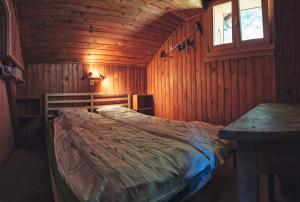 Rúm í herbergi á Chalet les Mésanges - Salvan