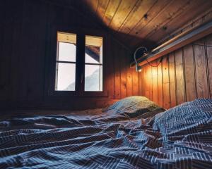 Rúm í herbergi á Chalet les Mésanges - Salvan