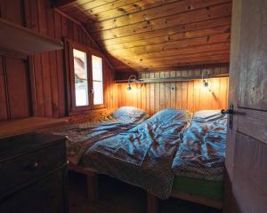 Rúm í herbergi á Chalet les Mésanges - Salvan