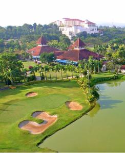 an aerial view of a golf course with a pond at EVO Soho Suites Duplex Homestay in Bandar Baru Bangi