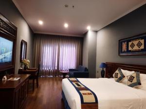 Postel nebo postele na pokoji v ubytování Pistachio Hotel Sapa