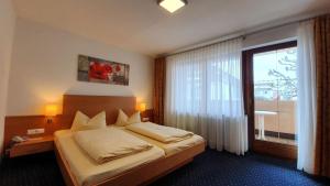 Postel nebo postele na pokoji v ubytování Hotel Restaurant Adler
