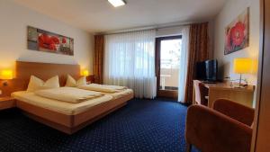 Postel nebo postele na pokoji v ubytování Hotel Restaurant Adler + 28 fotografií