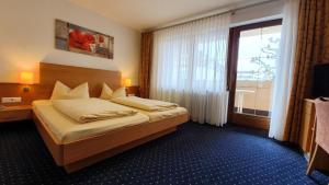 Postel nebo postele na pokoji v ubytování Hotel Restaurant Adler