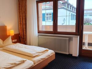 Postel nebo postele na pokoji v ubytování Hotel Restaurant Adler
