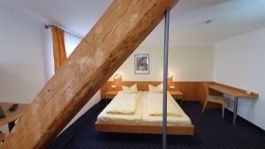 Postel nebo postele na pokoji v ubytování Hotel Restaurant Adler
