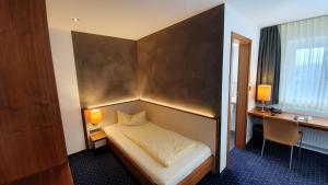 Postel nebo postele na pokoji v ubytování Hotel Restaurant Adler