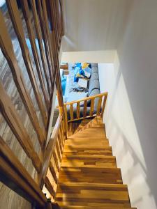 a staircase leading up to a room with a bed at Apartman Jahorina 6 in Jahorina