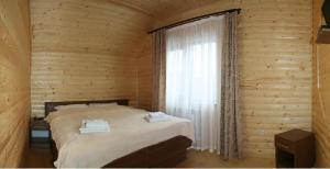 Postel nebo postele na pokoji v ubytování Proskurov Holiday Home