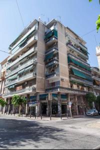 a large apartment building on a city street at Beautiful apartment Athens Keramikos in Athens