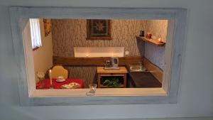 a small kitchen with a table and a sink at Srub u Krále in Dobruška +63 photos