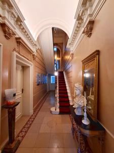 a hallway with a staircase in a building at Maison Jamaer in Brussels