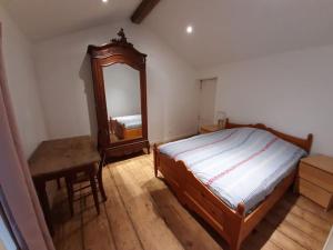 En eller flere senge i et værelse på Gite le haut des maraichers