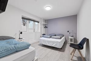 Postel nebo postele na pokoji v ubytování Acco Guesthouse