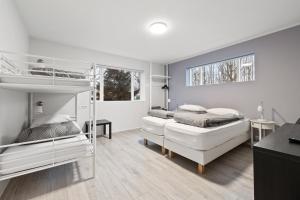 Postel nebo postele na pokoji v ubytování Acco Guesthouse