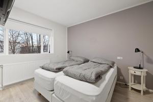 Postel nebo postele na pokoji v ubytování Acco Guesthouse