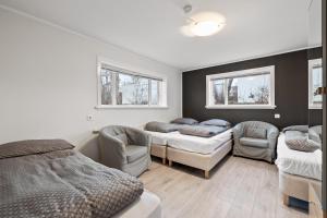Postel nebo postele na pokoji v ubytování Acco Guesthouse