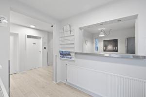 TV a/nebo společenská místnost v ubytování Acco Guesthouse