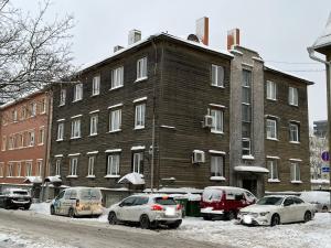 a group of cars parked in front of a building at City apartment mini-spa in Tallinn