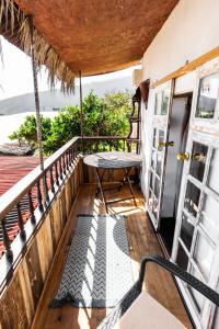 a balcony with a table and an open door at Los Pajaros in Santa Cruz de Tenerife