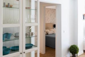 Postel nebo postele na pokoji v ubytování Flower Beach Suite 15