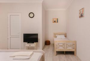 TV a/nebo společenská místnost v ubytování Marcos Hotel