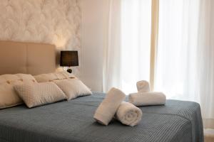 Postel nebo postele na pokoji v ubytování Flower Beach Suite 15