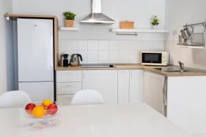 Kuchyň nebo kuchyňský kout v ubytování Flower Beach Suite 15
