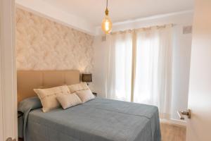Postel nebo postele na pokoji v ubytování Flower Beach Suite 15