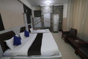 Voodi või voodid majutusasutuse Mahadev Hotel and Resorts toas