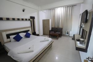Voodi või voodid majutusasutuse Mahadev Hotel and Resorts toas