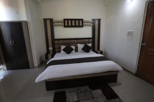 Voodi või voodid majutusasutuse Mahadev Hotel and Resorts toas