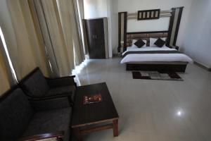 Voodi või voodid majutusasutuse Mahadev Hotel and Resorts toas