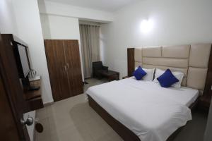 Voodi või voodid majutusasutuse Mahadev Hotel and Resorts toas