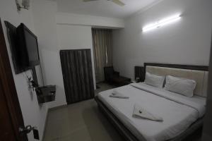 Voodi või voodid majutusasutuse Mahadev Hotel and Resorts toas