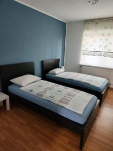 Voodi või voodid majutusasutuse Wohnung in Dortmund toas