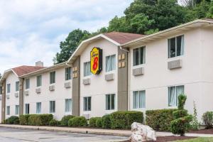 a hotel building with a sign on it at Super 8 by Wyndham Pittsburgh/Monroeville in Monroeville