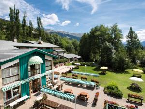 an aerial view of a resort with benches and tables at Club Vacances Bleues Les Alpes d'Azur in La Salle-les-Alpes