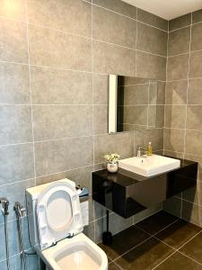 a bathroom with a toilet and a sink at Ipoh Peaceful Onsen 1 BR Lost World Tambun in Tambun +16 photos