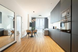 a kitchen and living room with a table and a dining room at 18037 Designer apartments in the residential complex "Yaroslaviv Grad" in Kyiv
