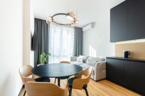 a living room with a table and a couch at 18037 Designer apartments in the residential complex "Yaroslaviv Grad" in Kyiv