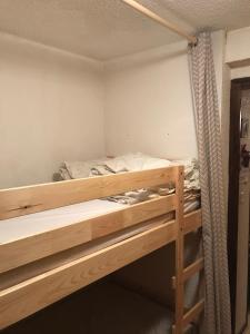 a bedroom with two bunk beds in it at Coup de coeur - Centre station, Proche pistes de ski in Les Deux Alpes