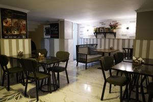 a restaurant with tables and chairs in a room at Old City Viva Hotel in Istanbul