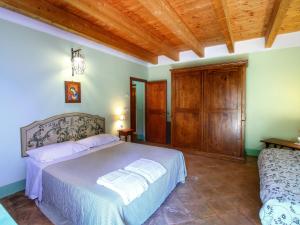 A bed or beds in a room at Holiday Home in Assisi near Monte Subasio