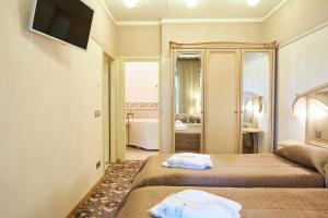 Postel nebo postele na pokoji v ubytování Grand SPA Lietuva Serviced Apartments Dzūkija