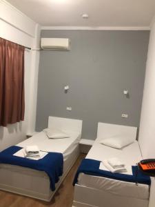 Postel nebo postele na pokoji v ubytování Sparta Team Hotel