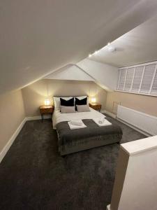 a bedroom with a large bed in a attic at Stylish 3 Bed Home in Clitheroe in Clitheroe